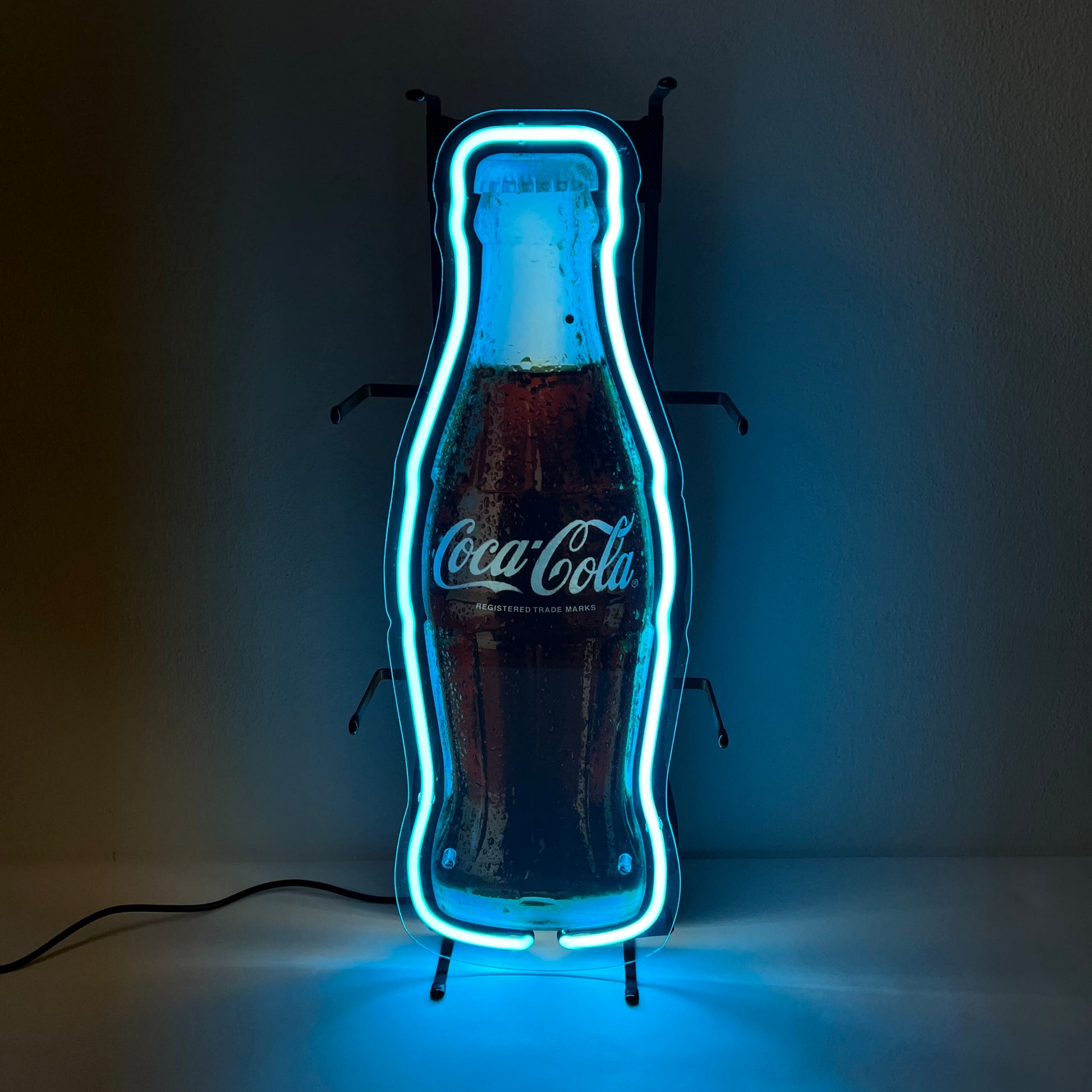 Insegna luminosa Coca-Cola a forma di bottiglia