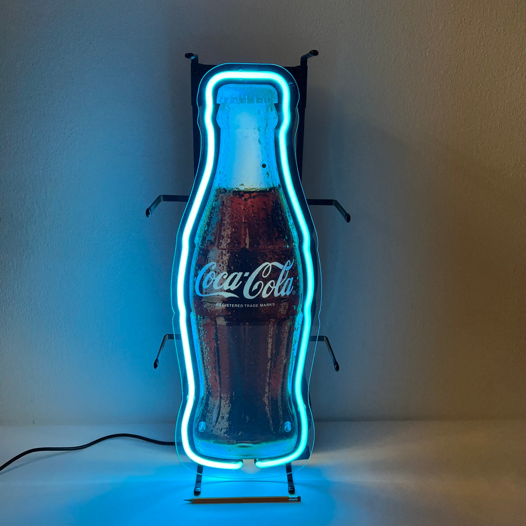 Insegna luminosa Coca-Cola a forma di bottiglia