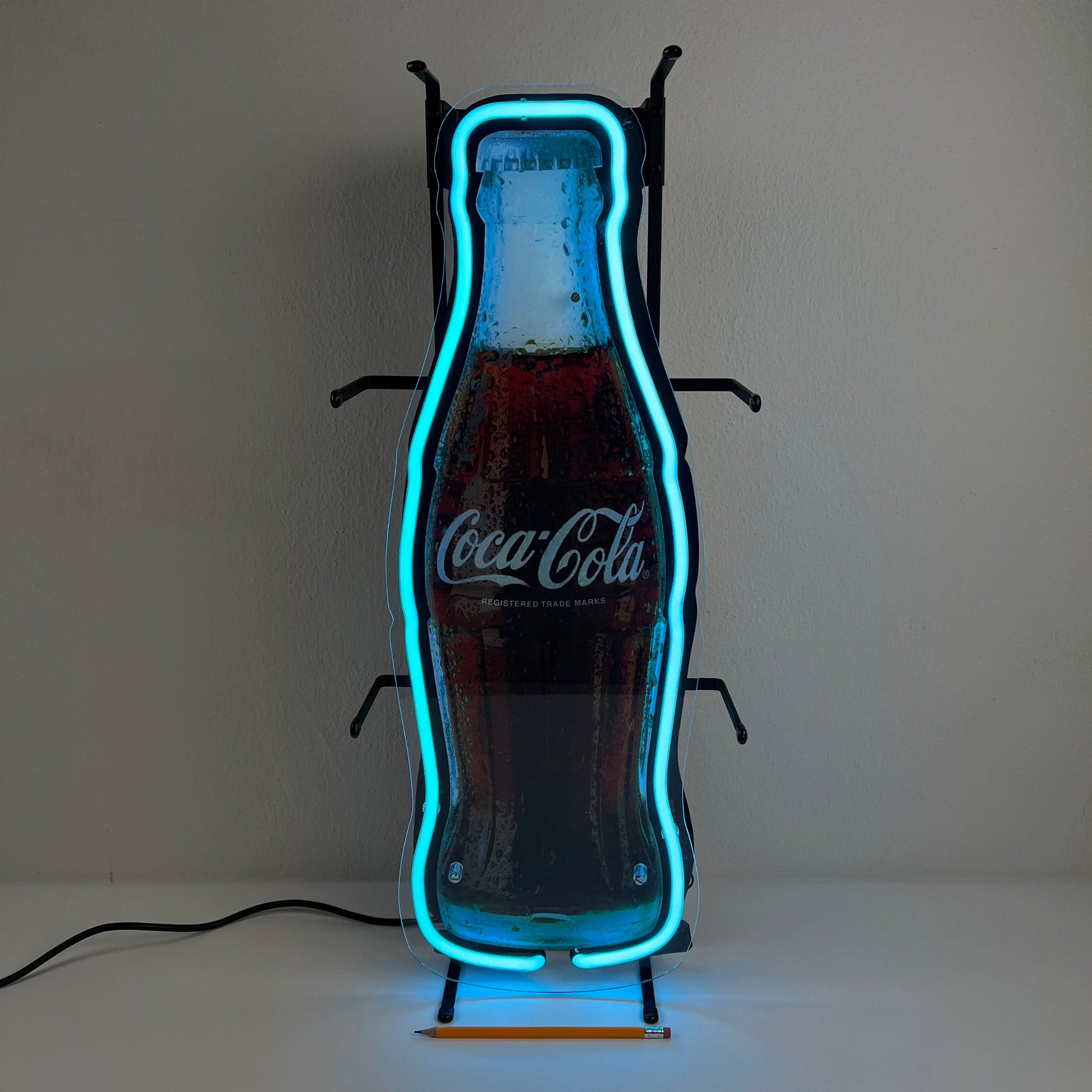 Insegna luminosa Coca-Cola a forma di bottiglia