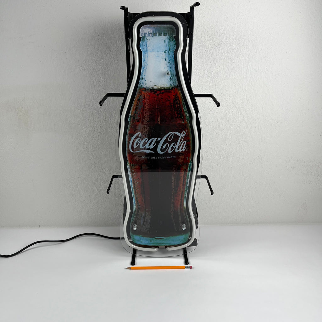 Insegna luminosa Coca-Cola a forma di bottiglia