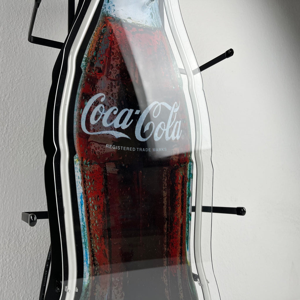 Insegna luminosa Coca-Cola a forma di bottiglia
