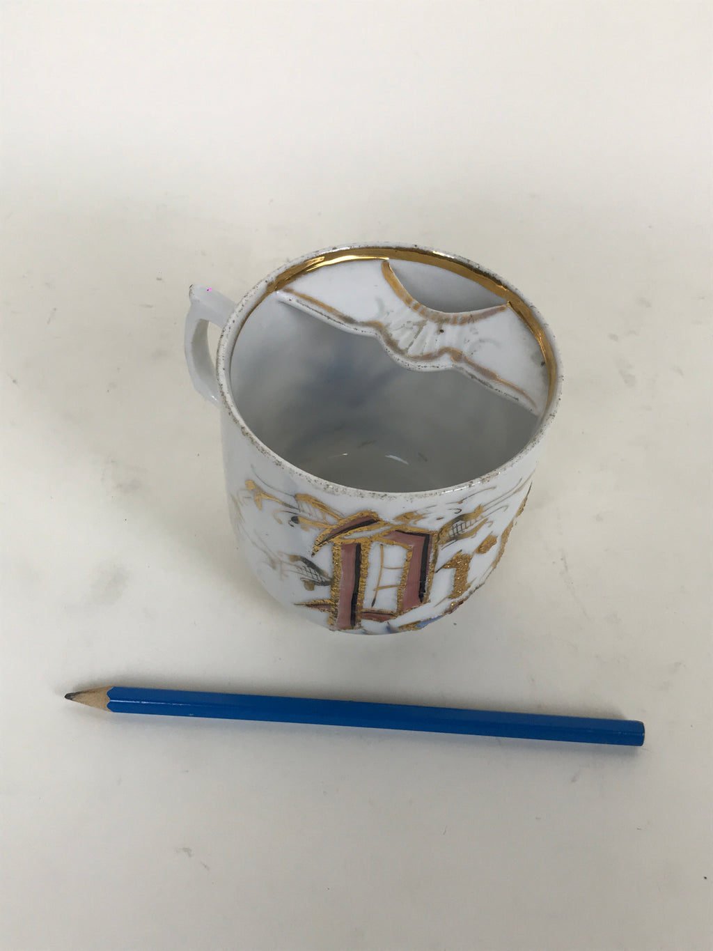 Porcelain moustache cup