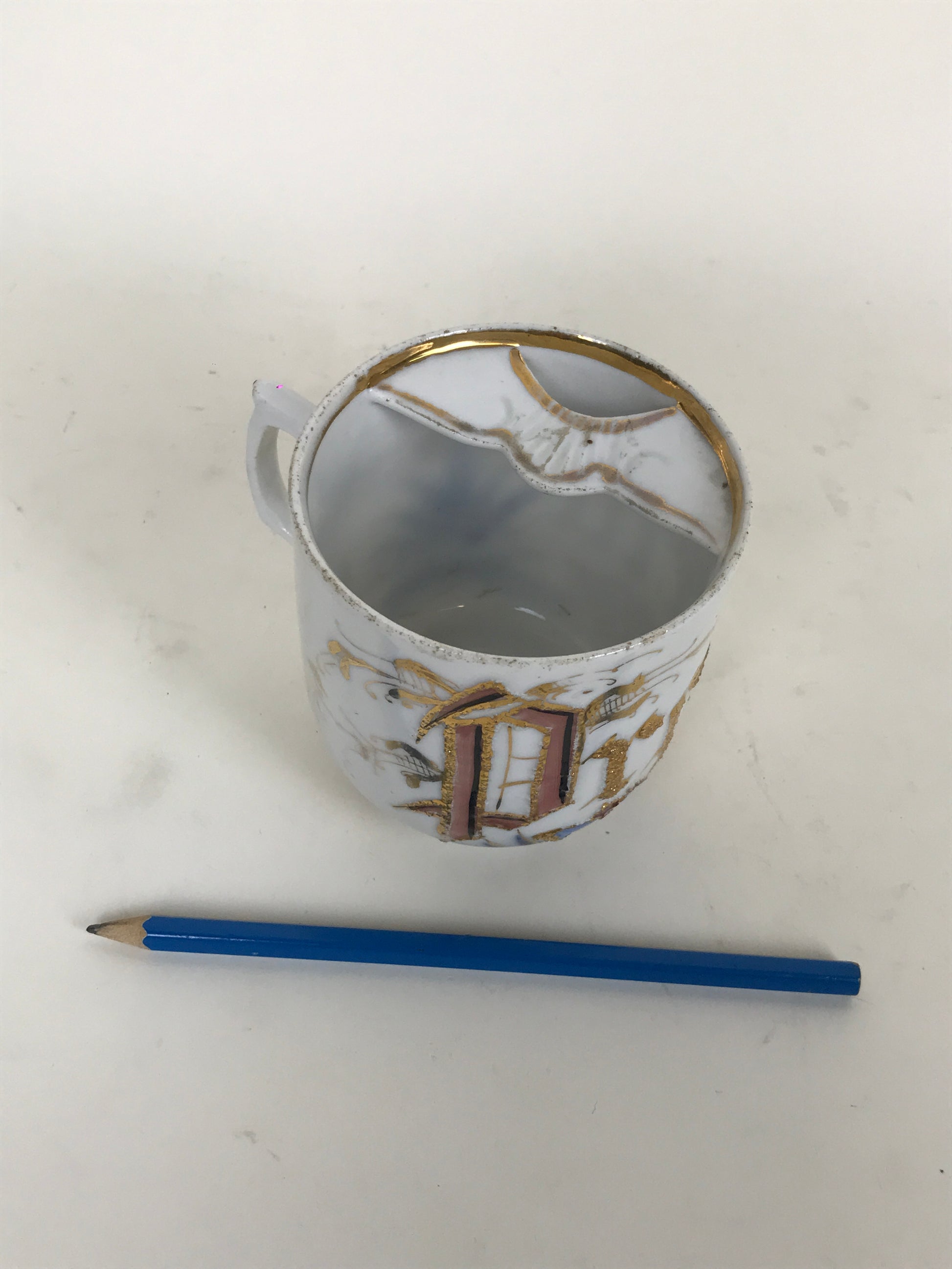 Porcelain moustache cup