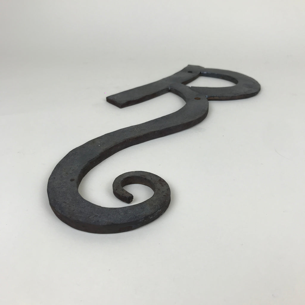 Wrought iron "R" sign | 1980s