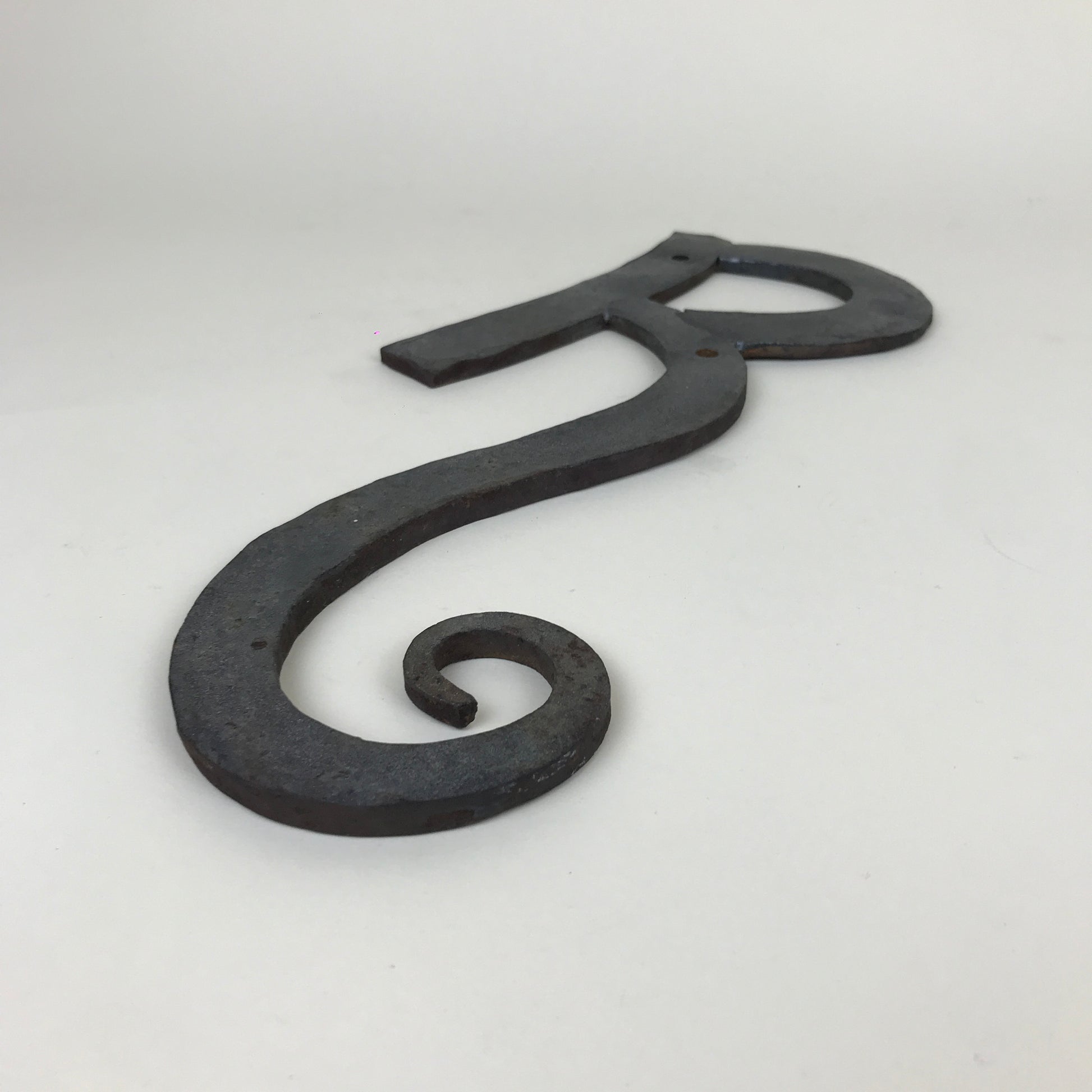 Wrought iron "R" sign | 1980s